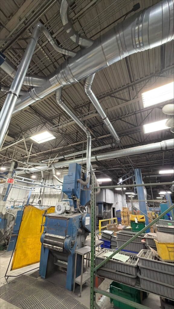 Another view of the vertical drops and machine connections beside the yellow guards.